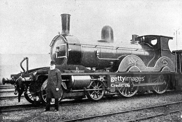 thomas higgs with a steam locomotive used when the queen traveled - 19th century steam train stock illustrations