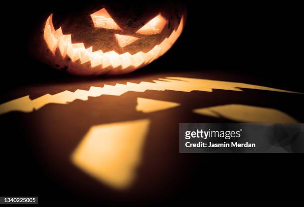 scary face shadow of halloween pumpkin - scary pumpkin faces bildbanksfoton och bilder