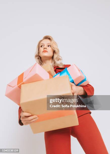 holiday gifts. photo from bottom view - red and pink outfit stock pictures, royalty-free photos & images