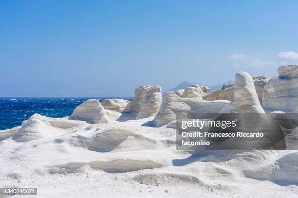 sarakiniko beach, white volcanic rock formations on milos island, cyclades, greece - sarakiniko beach stock pictures, royalty-free photos & images
