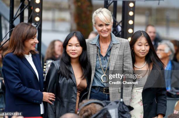 Laeticia Hallyday, widow of late French singer Johnny Hallyday, their daughters Jade and Joy and Paris Mayor Anne Hidalgo attend the inauguration of...