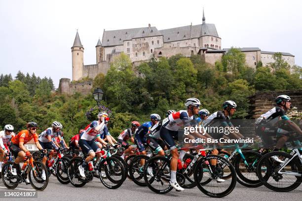 Antonio Tiberi of Italy and Team Trek - Segafredo, Tanel Kangert of Estonia and Team BikeExchange and The Peloton passing in front of the Vianden...