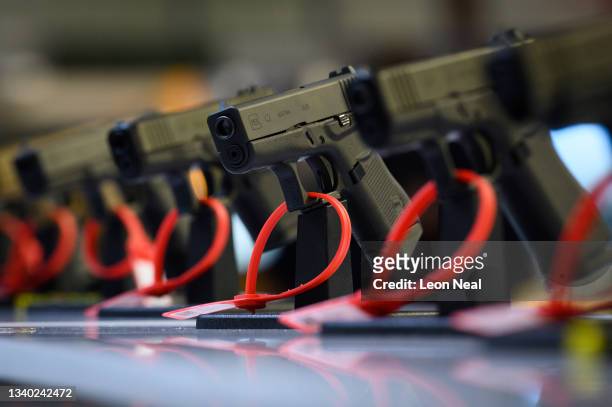 Row of Glock handguns are seen on day one of the DSEI exhibition at ExCel on September 14, 2021 in London, England. The four day event sees over...