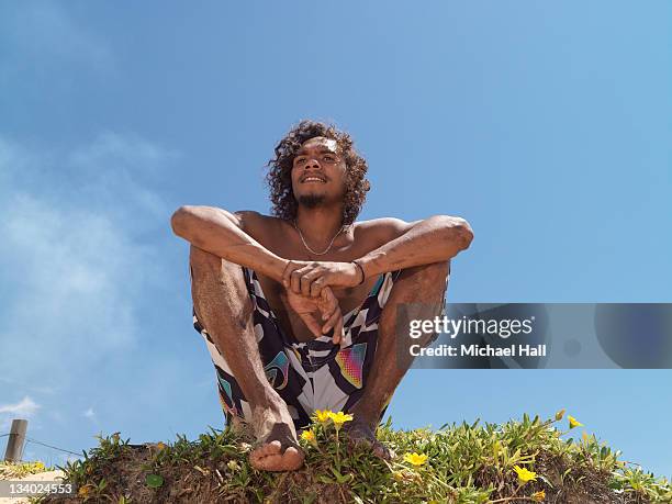 aboriginal boy at beach - aboriginal man stock pictures, royalty-free photos & images