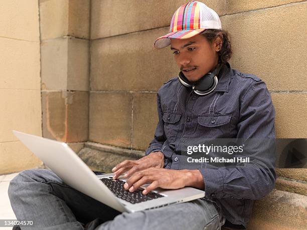 aboriginal boy studying with laptop - youth culture stock pictures, royalty-free photos & images