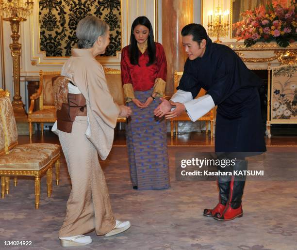 Bhutan's King Jigme Khesar Namgyel Wangehuk and Queen Jetsun Pema welcome Japan's Empress Michiko during her call at the Akasaka guest house on...