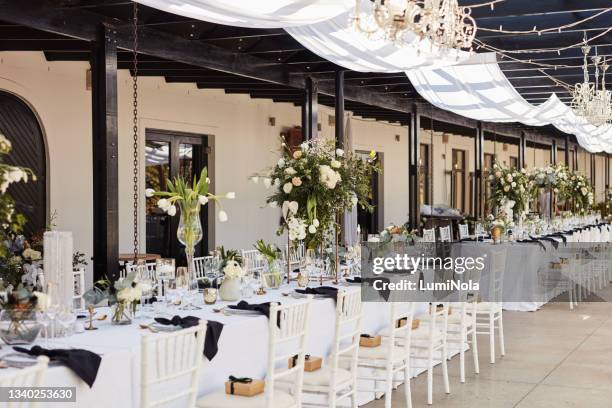 shot of an elegantly decorated table at a wedding reception - wedding venue stock pictures, royalty-free photos & images