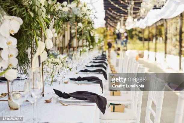 shot of an elegantly decorated table at a wedding reception - wedding reception stock pictures, royalty-free photos & images