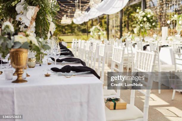 shot of an elegantly decorated table at a wedding reception - wedding guest gifts stock pictures, royalty-free photos & images