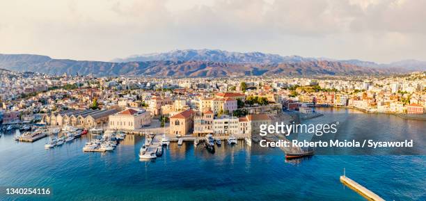 aerial view of harbor at dawn, chania, crete, greece - crete scenics stock pictures, royalty-free photos & images