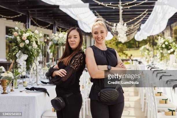 portrait of two confident young women decorating a wedding venue - event planner stock pictures, royalty-free photos & images