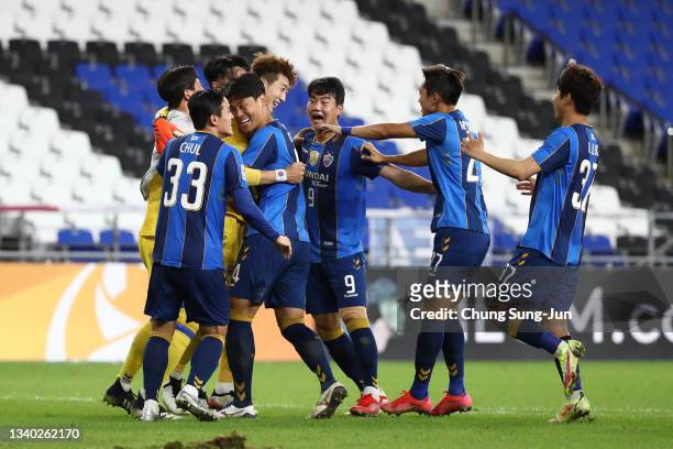 Players of Ulsan Hyundai celebrate in the penalty shootout during the AFC Champions League round of 16 match between Ulsan Hyundai and Kawasaki...