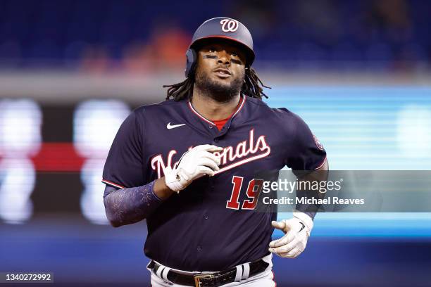 Josh Bell of the Washington Nationals rounds the bases after hitting a two-run home run off Edward Cabrera of the Miami Marlins during the seventh...