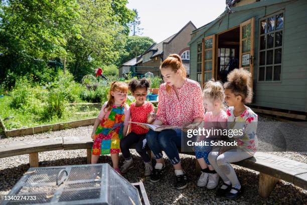 playground story time - child care worker stock pictures, royalty-free photos & images