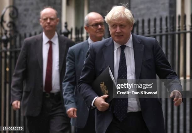 Britain's Chief Medical Officer for England Chris Whitty , Britain's Prime Minister Boris Johnson and Britain's Chief Scientific Adviser Patrick...
