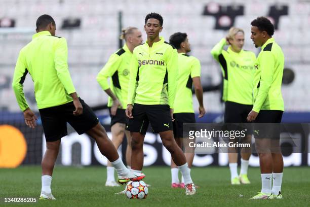 Jude Bellingham and Donyell Maelen of Borussia Dortmund attend a training session ahead of the UEFA Champions League Group C first match between...