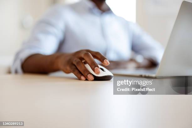 scrolling and clicking through a world of opportunity - hands using computer stock pictures, royalty-free photos & images