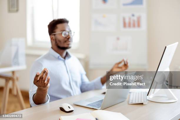some meditation before work - businessman meditating stock pictures, royalty-free photos & images