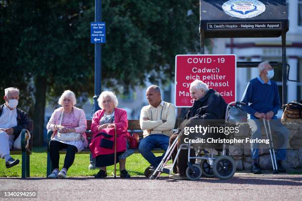 People relax on the promenade on September 14, 2021 in Llandudno, United Kingdom. As the end of Summer season nears people make the most of the...