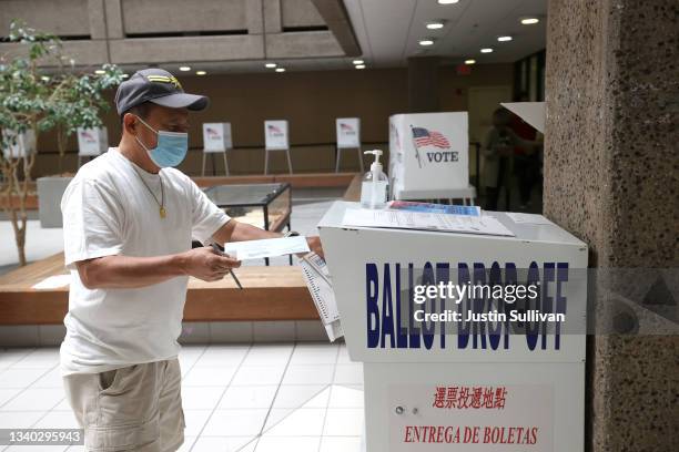 Voter drops his ballot for the California recall election into a drop box at the Santa Clara County registrar of voters office on September 14, 2021...