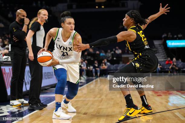 Kayla McBride of the Minnesota Lynx and Brittney Sykes of the Los Angeles Sparks compete in the second half of the game at Target Center on September...