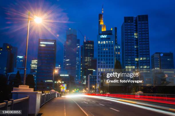 frankfurt traffic zooming across river main to night skyscrapers germany - frankfurt oder stock pictures, royalty-free photos & images