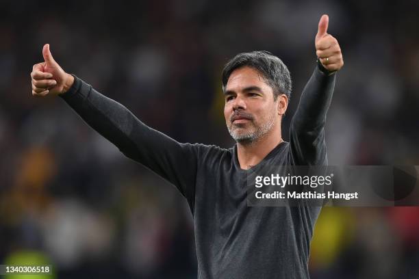 David Wagner, Head Coach of Young Boys gives a thumbs up to the fans following their side's victory in the UEFA Champions League group F match...