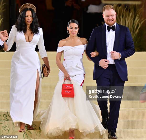 Aurora James, Alexandria Ocasio-Cortez and Riley Roberts leave the 2021 Met Gala Celebrating In America: A Lexicon Of Fashion at Metropolitan Museum...