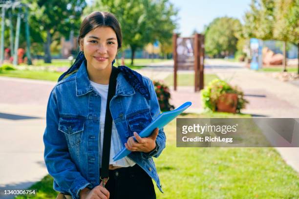 college student on campus - community college stock pictures, royalty-free photos & images
