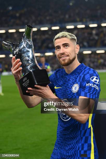 Jorginho of Chelsea poses for a photo with the Men's player of the year award 2020/2021 prior to the UEFA Champions League group H match between...