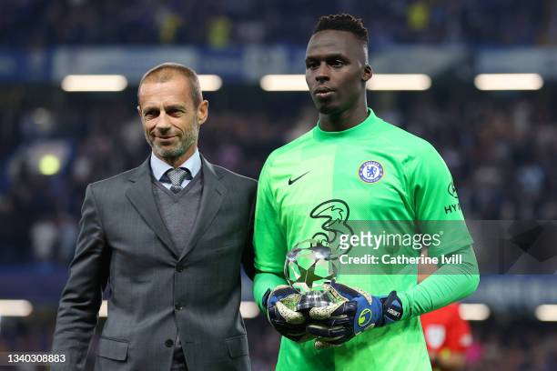 President Aleksander Ceferin poses for a photograph with Edouard Mendy of Chelsea after receiving the Goal Keeper of the year 2020/21 award prior to...