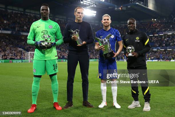 Edouard Mendy, Thomas Tuchel, Manager of Chelsea, Jorginho and Ngole Kante of chelsea pose for a photo with their respective awards for their...
