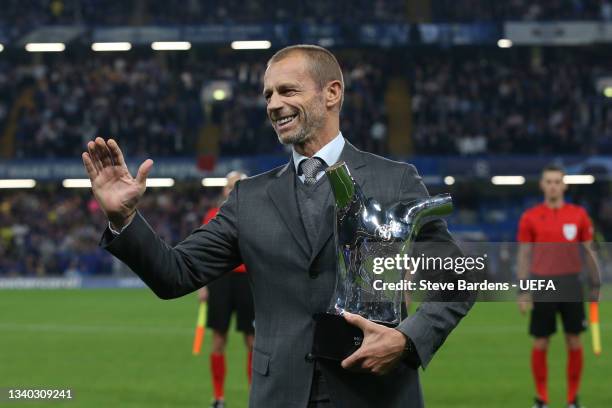 President, Aleksander Ceferin presents stands with the Men's player of the year award 2020/2021 prior to the UEFA Champions League group H match...