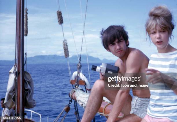 English musician, singer, songwriter and guitarist for the Beatles, George Harrison and wife Pattie Boyd while on vacation in Papeete, Tahiti in...