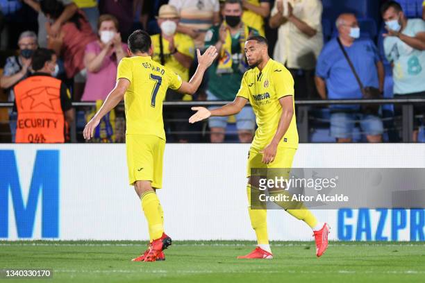 Arnaut Danjuma of Villarreal celebrates with teammate Gerard Moreno after scoring their side's second goal during the UEFA Champions League group F...