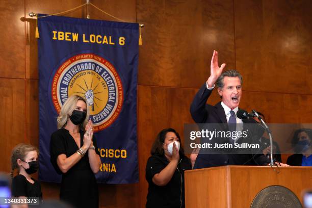 California Gov. Gavin Newsom speaks to union workers and volunteers on election day at the IBEW Local 6 union hall as his wife Jennifer Siebel Newsom...