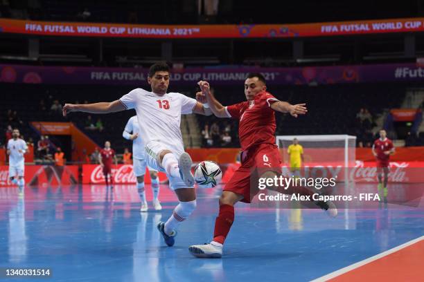 Denis Ramic of Serbia is tackled by Farhad Tavakoli of IR Iran during the FIFA Futsal World Cup 2021 group F match between Serbia and IR Iran at...