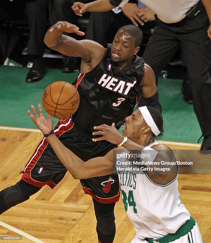 (042710, Boston, MA) Boston Celtics forward Paul Pierce and Miami Heat guard Dwyane Wade battle for the loose ball after Wade blocked the shot as the Celtics take on the Heat at the Garden. Tuesday, April 27, 2010. (Staff photo by Stuart
