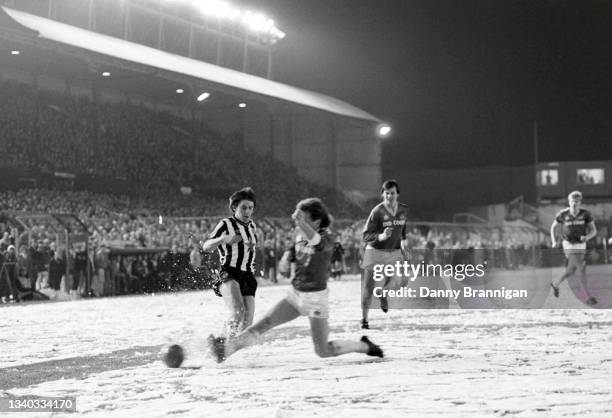 Newcastle United striker Peter Beardsley is challenged by Foxes defender Russell Osman and the snow covered pitch during a 2-1 League Division One...