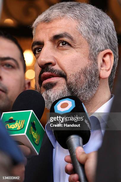 In this handout photo provided by Khaled Meshaal's Office of Media, leader of Hamas Khaled Meshaal gives a statement to the media after meeting with...