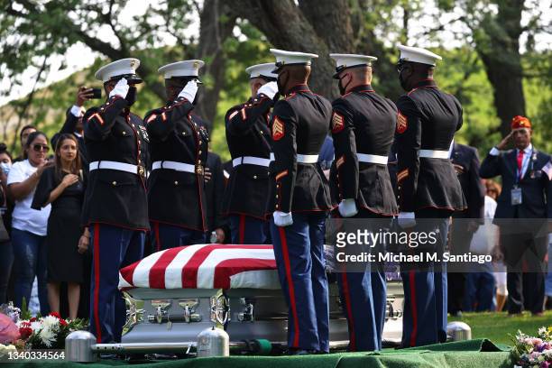 Marines pallbearers salute the casket of Sgt. Johanny Rosario Pichardo at her funeral in Bellevue Cemetery on September 14, 2021 in Lawrence,...
