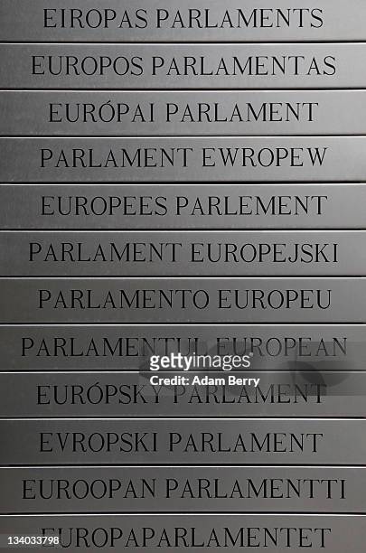 Plaque lists the words "European Parliament" written in the languages of its 27 member countries outside the Parliament's building on November 22,...