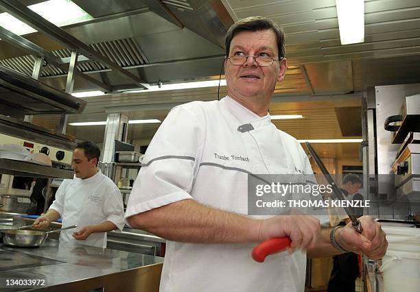 Chef Harald Wohlfahrt sharpens a knife in the kitchen of his restaurant Schwarzwaldstube in the hotel Traube Tonbach in Baiersbronn in the Black...
