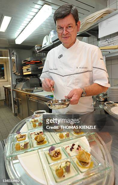 Chef Harald Wohlfahrt prepares food in the kitchen of his restaurant Schwarzwaldstube in the hotel Traube Tonbach in Baiersbronn in the Black Forest,...