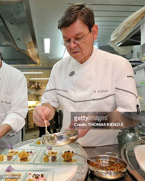 Chef Harald Wohlfahrt prepares the amuse gueules in the kitchen of his restaurant Schwarzwaldstube in the hotel Traube Tonbach in Baiersbronn in the...