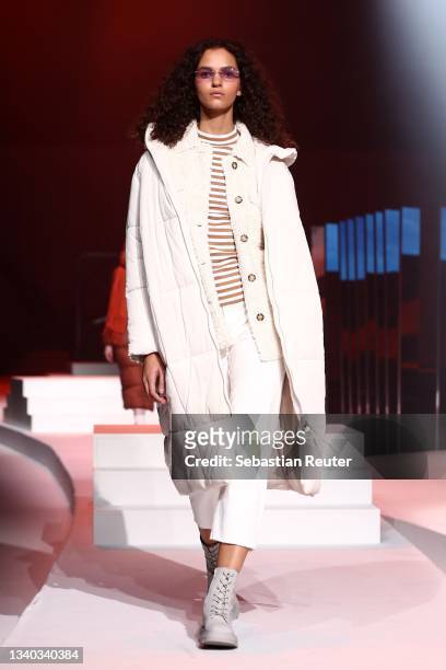 Model walks the runway at the Esprit show during the ABOUT YOU Fashion Week Autumn/Winter 21 at Kraftwerk on September 14, 2021 in Berlin, Germany.
