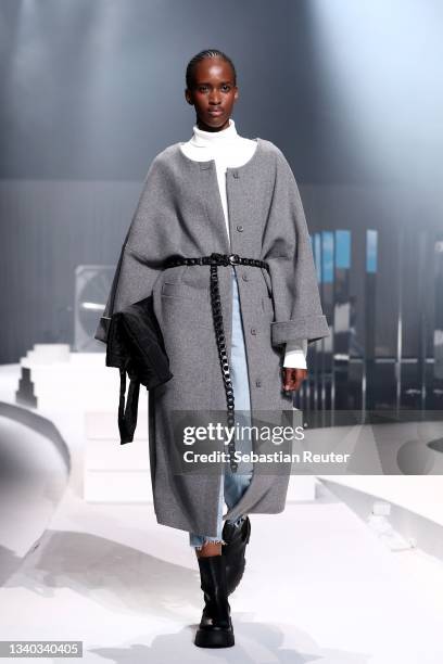 Model walks the runway at the Esprit show during the ABOUT YOU Fashion Week Autumn/Winter 21 at Kraftwerk on September 14, 2021 in Berlin, Germany.