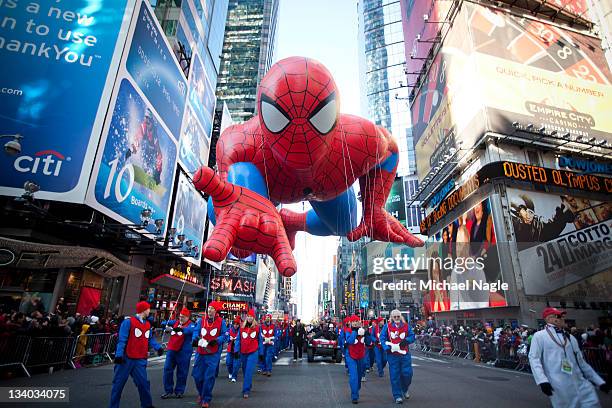 The Spiderman balloon makes its way through Times Square in Macy's Thanksgiving Day parade on November 24, 2011 in New York City. The 85th annual...