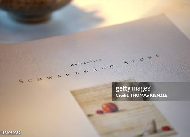 The menu is seen on a table in Chef Harald Wohlfahrt's restaurant Schwarzwaldstube in the hotel Traube Tonbach in Baiersbronn in the Black Forest,...