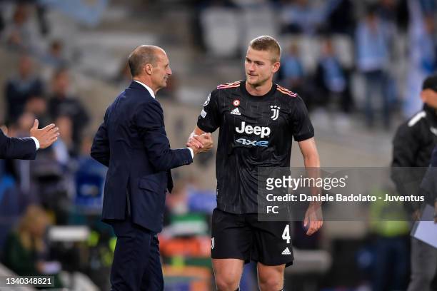 Juventus' player Matthijs de Ligt is substituted and greets his coach Massimiliano Allegri during the UEFA Champions League group H match between...